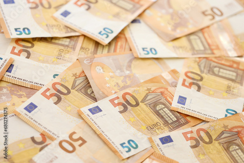 Fototapeta Naklejka Na Ścianę i Meble -  Very big amount of fifty european euro banknotes in huge pile close up