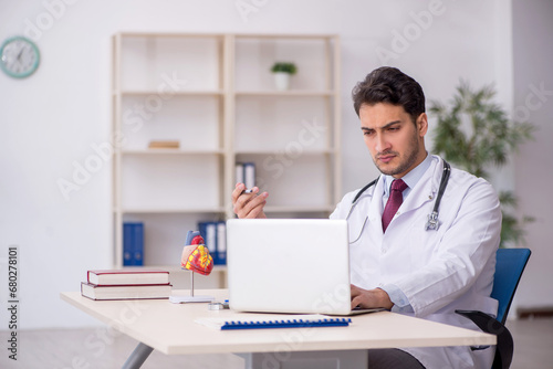 Young male doctor in telemedicine concept