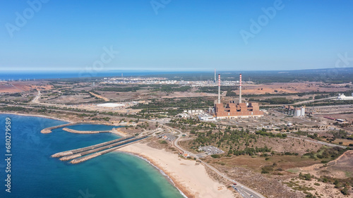 Aerial view of a coal-fired power plant in city of Sines and sea channels to cool the station.