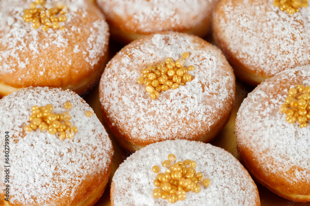 Hanukkah holiday card with sweet doughnuts sufganiyot (traditional donuts), Golden baner. Selective focus