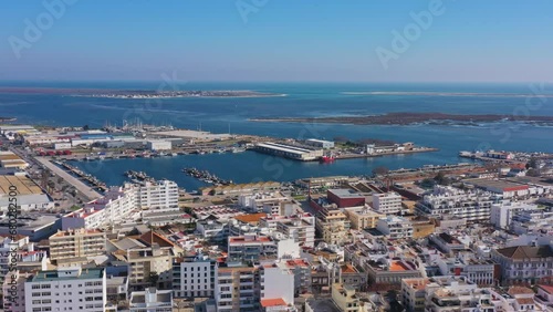 Aerial drone footage of the Portuguese southern town of Olhao. View of the industrial dock for fishermen. photo