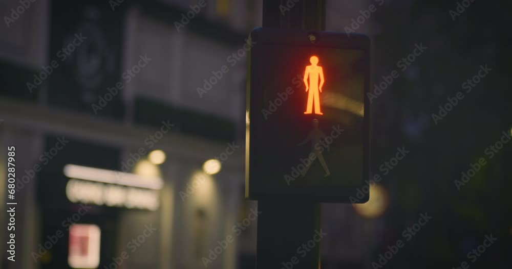 Pedestrian crossing lights in city at night
