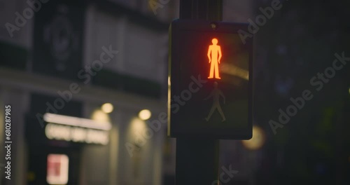 Pedestrian crossing lights in city at night photo