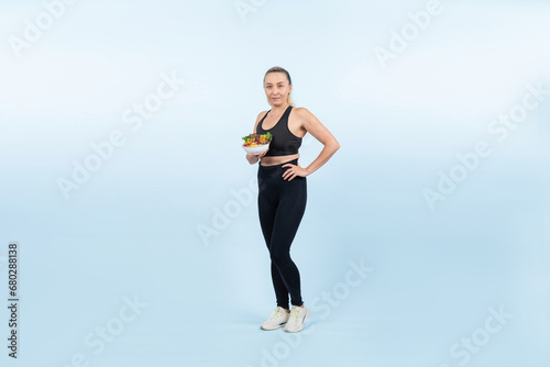 Fototapeta Naklejka Na Ścianę i Meble -  Happy smile senior woman portrait holding bowl of vegan fruit and vegetable on isolated background. Healthy senior people with healthy vegetarian nutrition and body care lifestyle. Clout