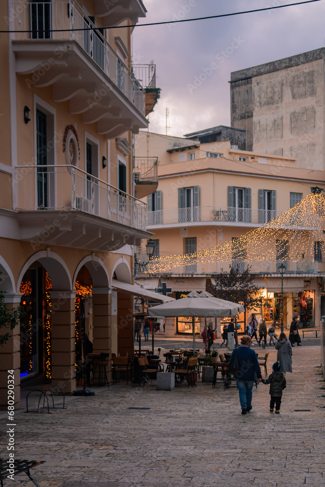 Christmas atmosphere in Kerkyra, Greece with colorful decorated streets and people walking by the main square of the town. corfu, Greece