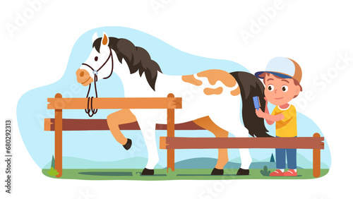 Equestrian boy grooming horse, combing tail hair
