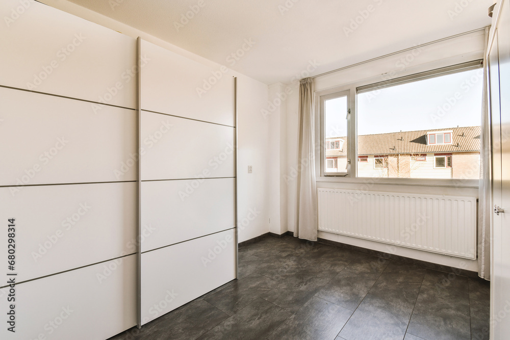 Empty room with wardrobe and window Empty room with wardrobe and window