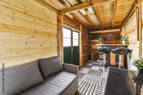 Wooden cabin with sofa and coffee table photo
