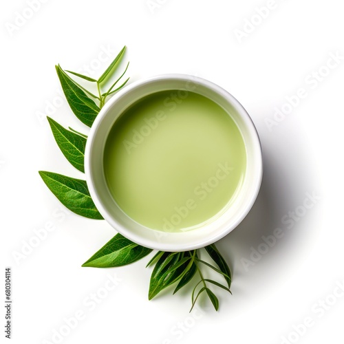 Top view of cup of matcha green tea on white background.