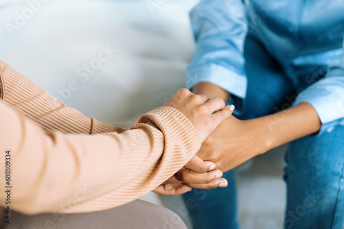 Close up shot of supportive and comforting hands for cheering up depressed patient person or stressed mind with crucial empathy © Summit Art Creations