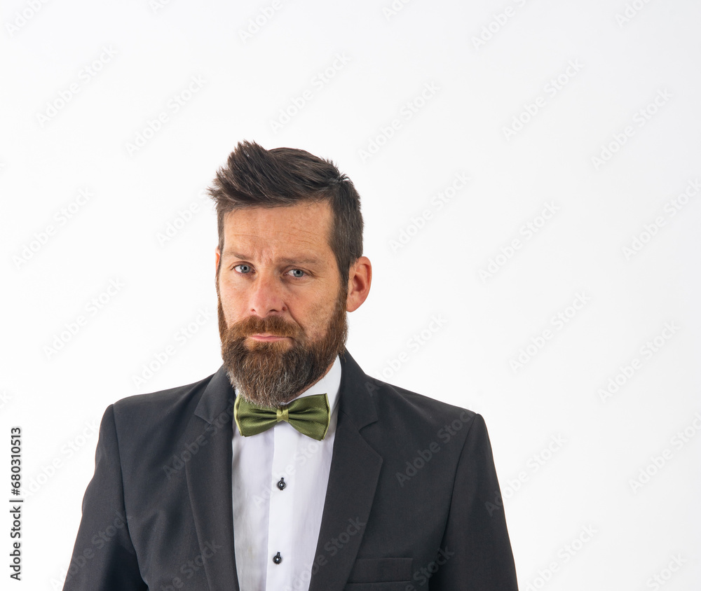 Handsome young white man groom with wedding black suit and bow tie isolated on white background Handsome young white man groom with wedding black suit and bow tie isolated on white background