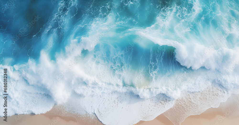 Overhead photo of crashing waves on the shoreline