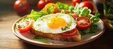 For their healthy lunch, they prepared a delicious sandwich made with white bread, topped with a fried egg, cheese, and salad, all served on a wheat plate alongside tomato slices and a vegetable salad