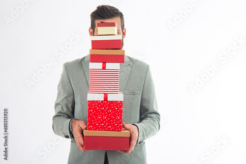 Bilde på lerret Man holding presents wrapped in gift paper  isolated on white background