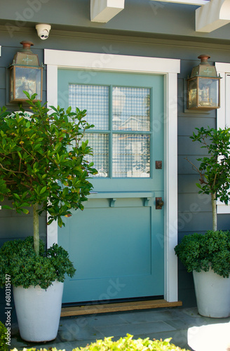 old fashioned beach bungalow with pastel turquoise Dutch door