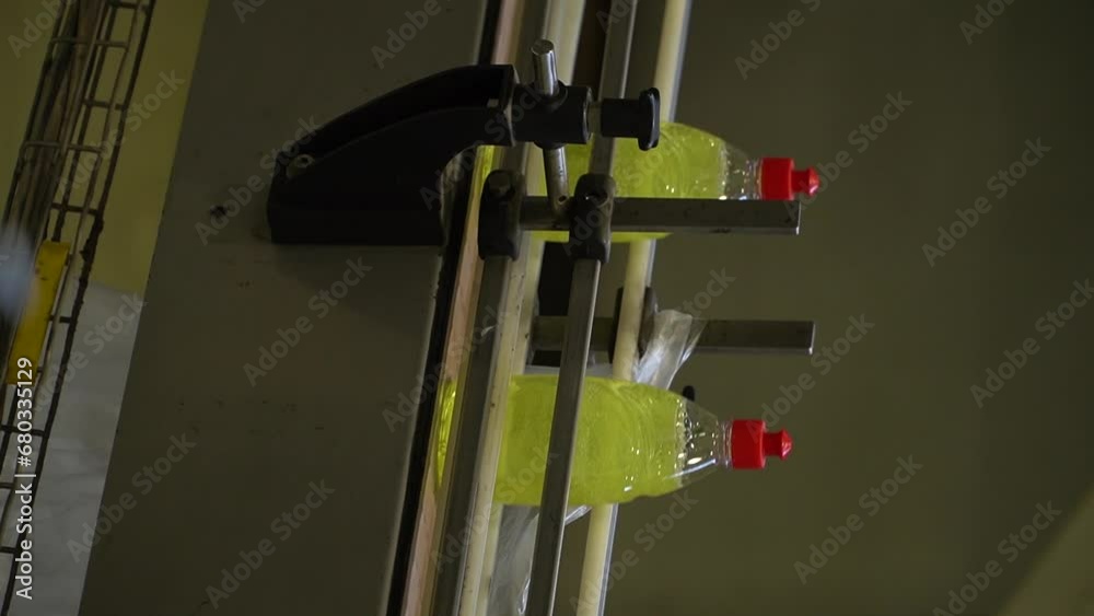 Plastic bottles passing by on conveyor belt.
Liquid detergent on automated production line. Machinery for bottling. Automated Chemical Products Filling, Capping And Labeling Line.
Plastic bottles passing by on conveyor belt.
Liquid detergent on automated production line. Machinery for bottling. Automated Chemical Products Filling, Capping And Labeling Line.