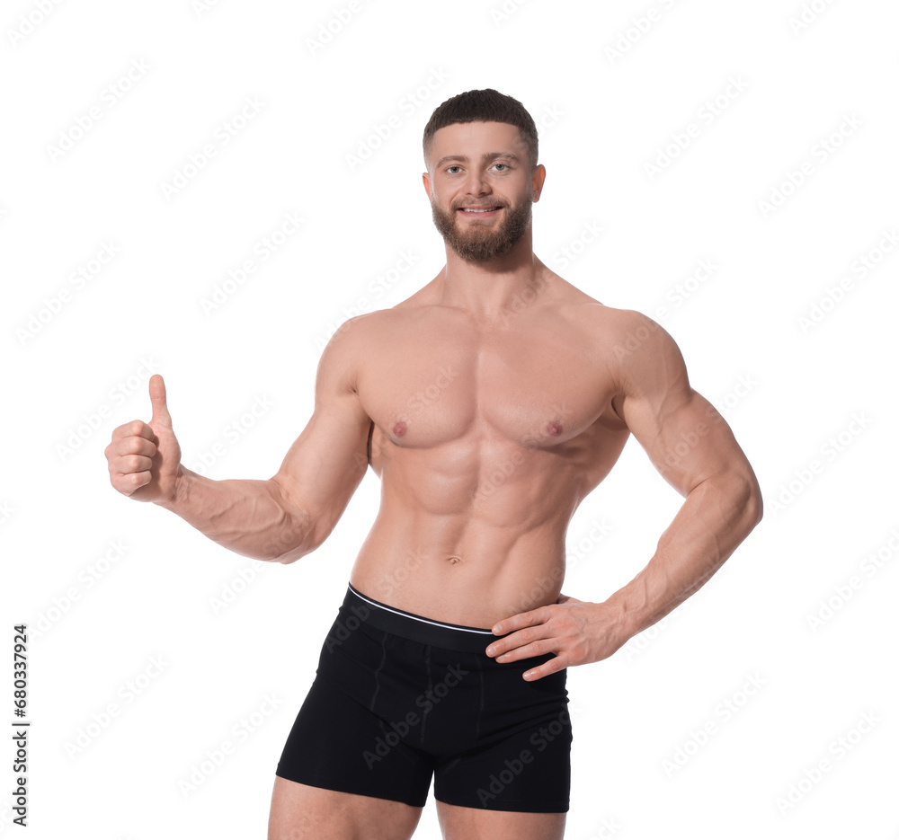 Young man is stylish black underwear showing thumb up on white background