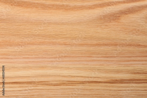 Texture of wooden cutting board as background, top view