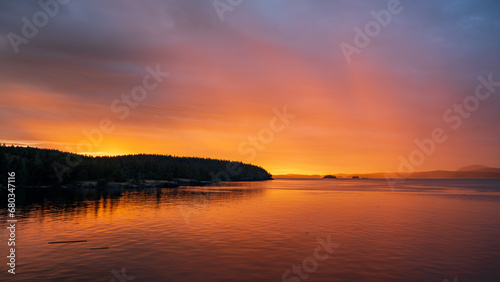 Beautiful sunset and rain in the distance from Salt Spring Island, British Columbia, Canada.