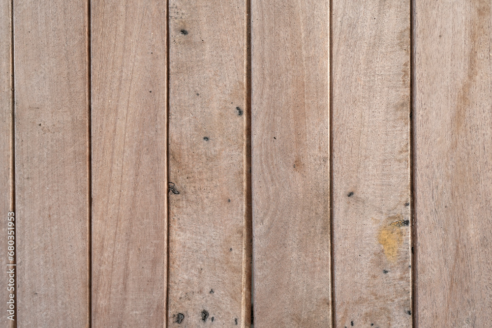 The texture of the wooden fence. The old dark boards, standing vertically. The boards soaked in the rain.For photomontage and collage