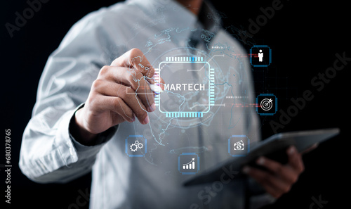 Martech marketing technology concept. Businessman touching network connection on online marketing system for digital market commerce online sale. Marketing automation and digital advertising. photo