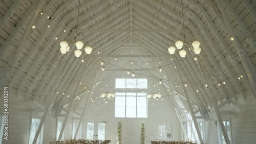 Bright White Elegant Wedding Barn Interior Setup for a Ceremony photo