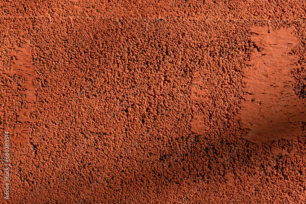 Bright orange concrete porous wall. Close-up. Background. Space for text. Bright orange concrete porous wall. Close-up. Background. Space for text.