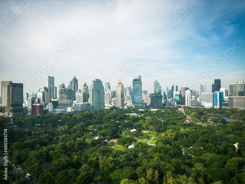 Aerial view of Lumphini Park backgrounded by the Silom area skyline office building business district