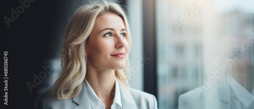 wealthy female young businesswoman looking away with optimism thinking in future investments and ventures