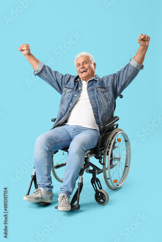 Happy mature man in wheelch...