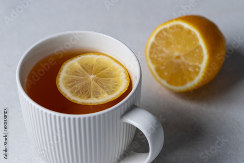 Tea with lemon in a white mug