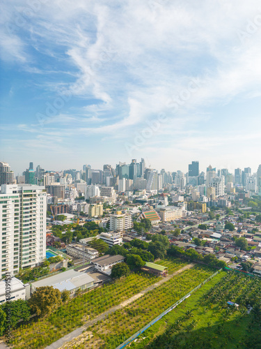 Aerial view of Lumphini Park backgrounded by the Silom area skyline office building business district © themorningglory