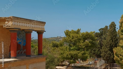 The north entrance to the Minoan Palace of Knossos in Heraklion, Crete, Greece with the charging bull fresco. Knossos is the largest Bronze Age archaeological site in Crete. photo