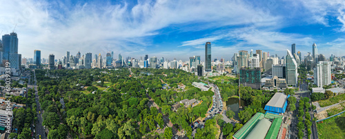 Aerial view of Lumphini Park backgrounded by the Silom area skyline office building business district photo