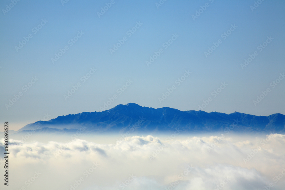 mountain peak and fog mountain peak and fog