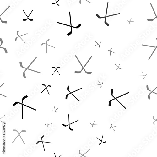 Seamless vector pattern with hockey symbols, creating a creative monochrome background with rotated elements. Vector illustration on white background