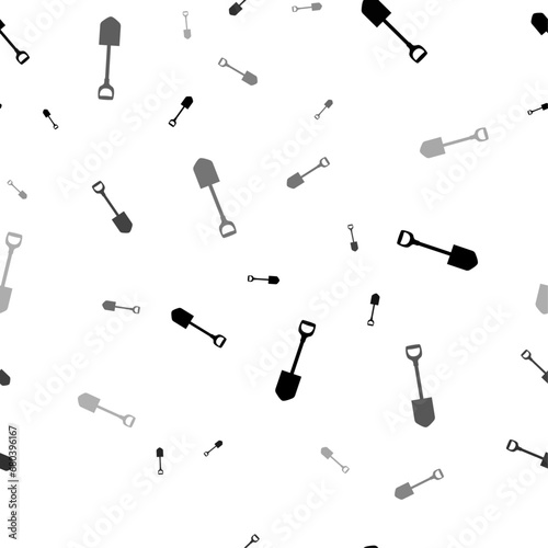 Seamless vector pattern with shovel symbols, creating a creative monochrome background with rotated elements. Vector illustration on white background