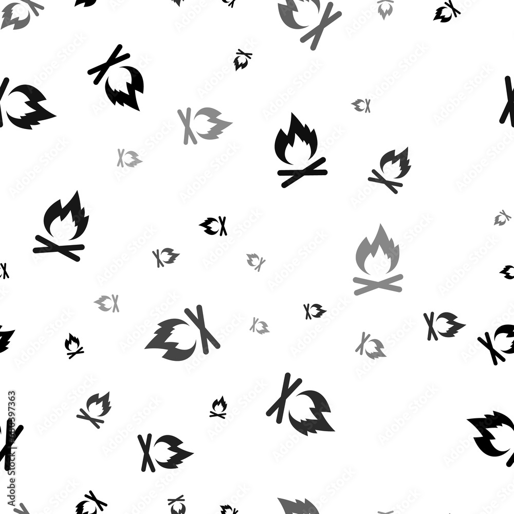Seamless vector pattern with bonfire symbols, creating a creative monochrome background with rotated elements. Illustration on transparent background