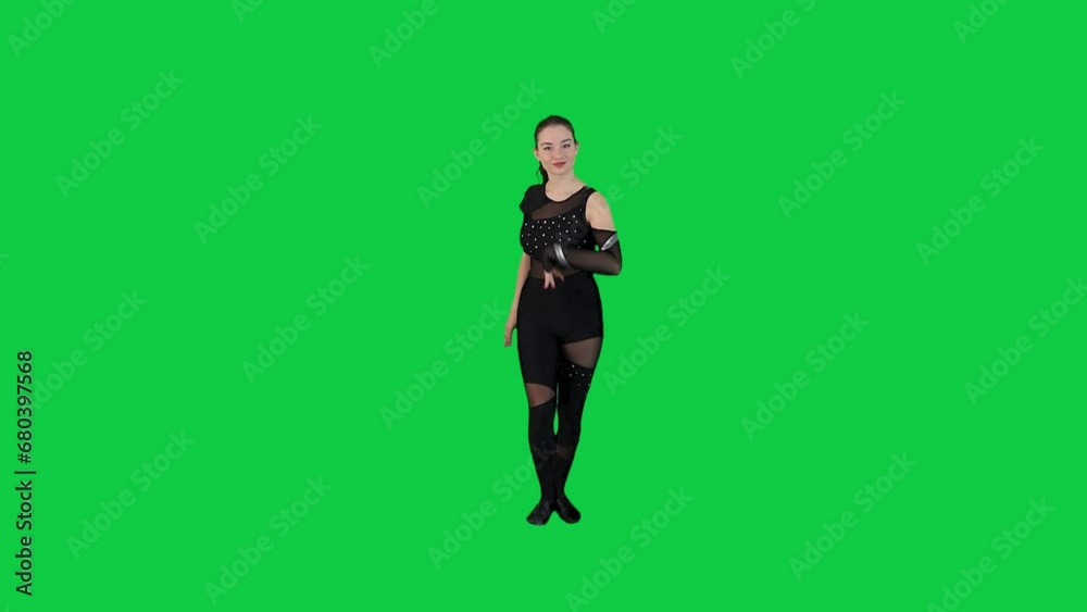 Professional female dance instructor performing in front of the green screen wearing a black body suit Professional female dance instructor performing in front of the green screen wearing a black body suit
