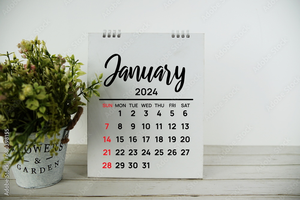 January 2024 monthly calendar with vintage alarm clock on wooden background - obrazy, fototapety, plakaty 