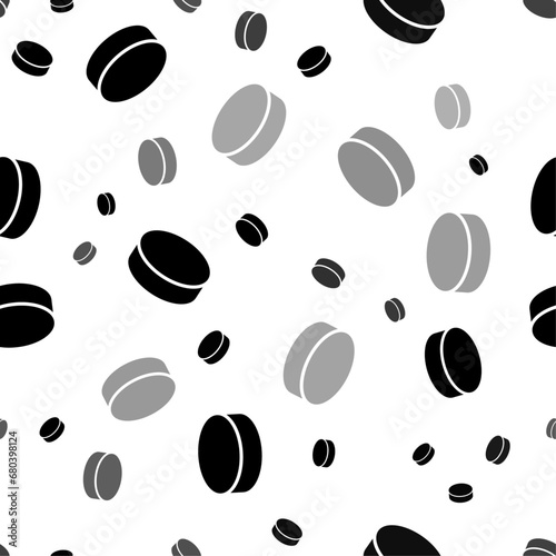 Seamless vector pattern with hockey pucks, creating a creative monochrome background with rotated elements. Vector illustration on white background