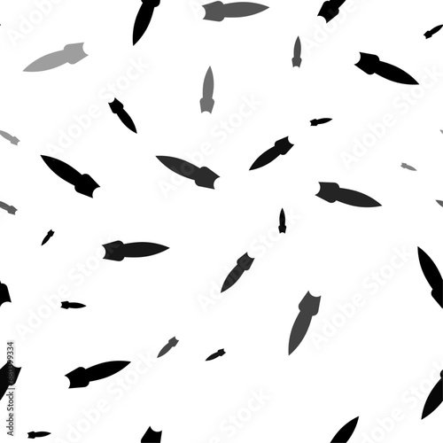 Seamless vector pattern with falling rocket symbols, creating a creative monochrome background with rotated elements. Vector illustration on white background