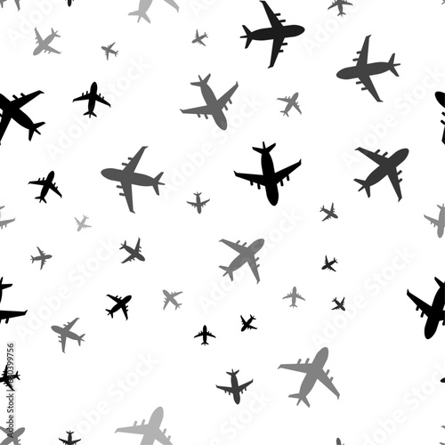 Seamless vector pattern with airplane symbols  creating a creative monochrome background with rotated elements. Vector illustration on white background