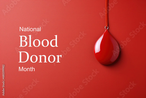 January national blood donor month concept. Pendant drop of blood and text on a red background, poster photo