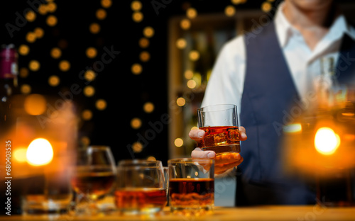 Bartender Serve Whiskey, on wood bar, 