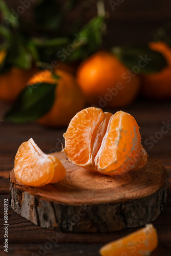 Tangerines in a plate on a wooden table