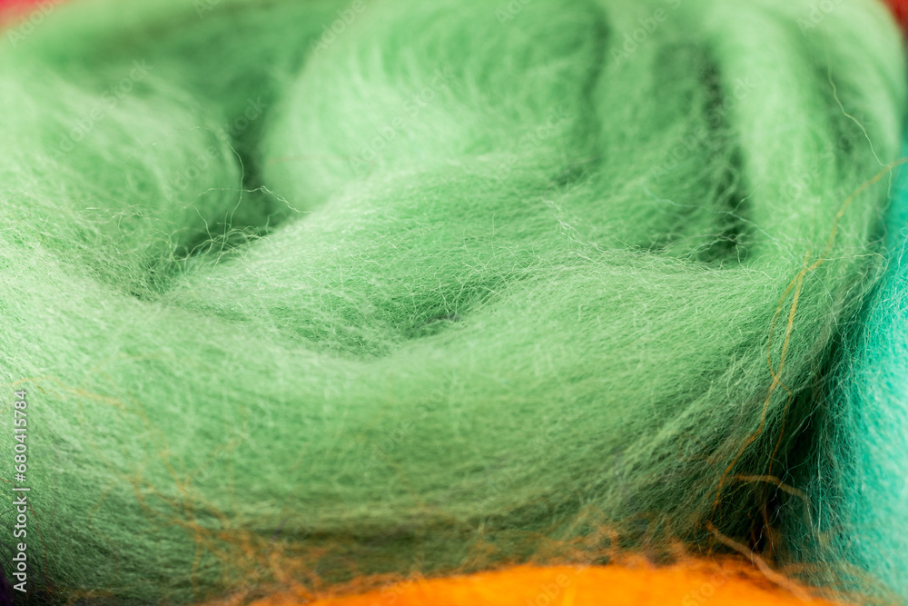 Wool fiber, merino wool of different colors bright colorful for yes handmade, knitting weaving and painting making, selective focus Wool fiber, merino wool of different colors bright colorful for yes handmade, knitting weaving and painting making, selective focus
