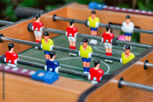 Table football, also known as foosball or table soccer, is a tabletop game that is loosely based on association football