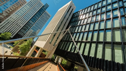 Creative rolling shot of a complex of corporate buildings in the Barbican and London Wall business district on a bright sunny day photo