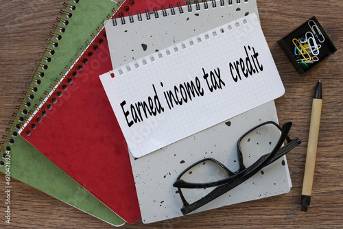 Wallpaper Mural EARNED INCOME TAX CREDIT. page from a notepad with text. gray and red notepad Torontodigital.ca